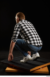 Stanley Johnson  1 casual dressed jeans kneeling shirt sneakers…